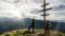 Hikers are standing at the mountain peak ©Carolin Thiersch